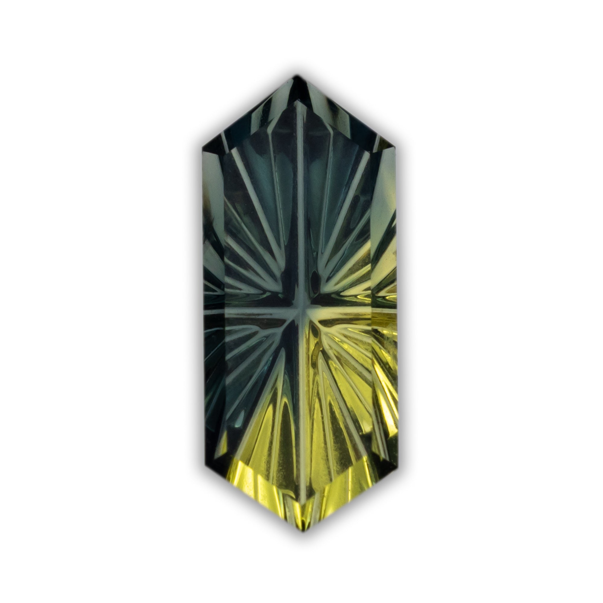 Elongated hexagon cut sapphire with green and yellow colors on a white background