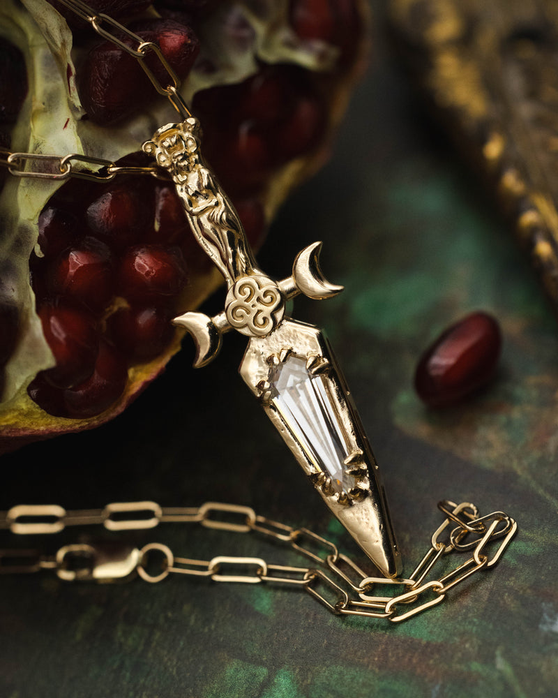 GODDESS DAGGER PENDANT IN 14K GOLD WITH AN ELONGATED KITE CUT MOISSANITE