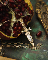 GODDESS DAGGER PENDANT IN 14K GOLD WITH AN ELONGATED KITE CUT MOISSANITE