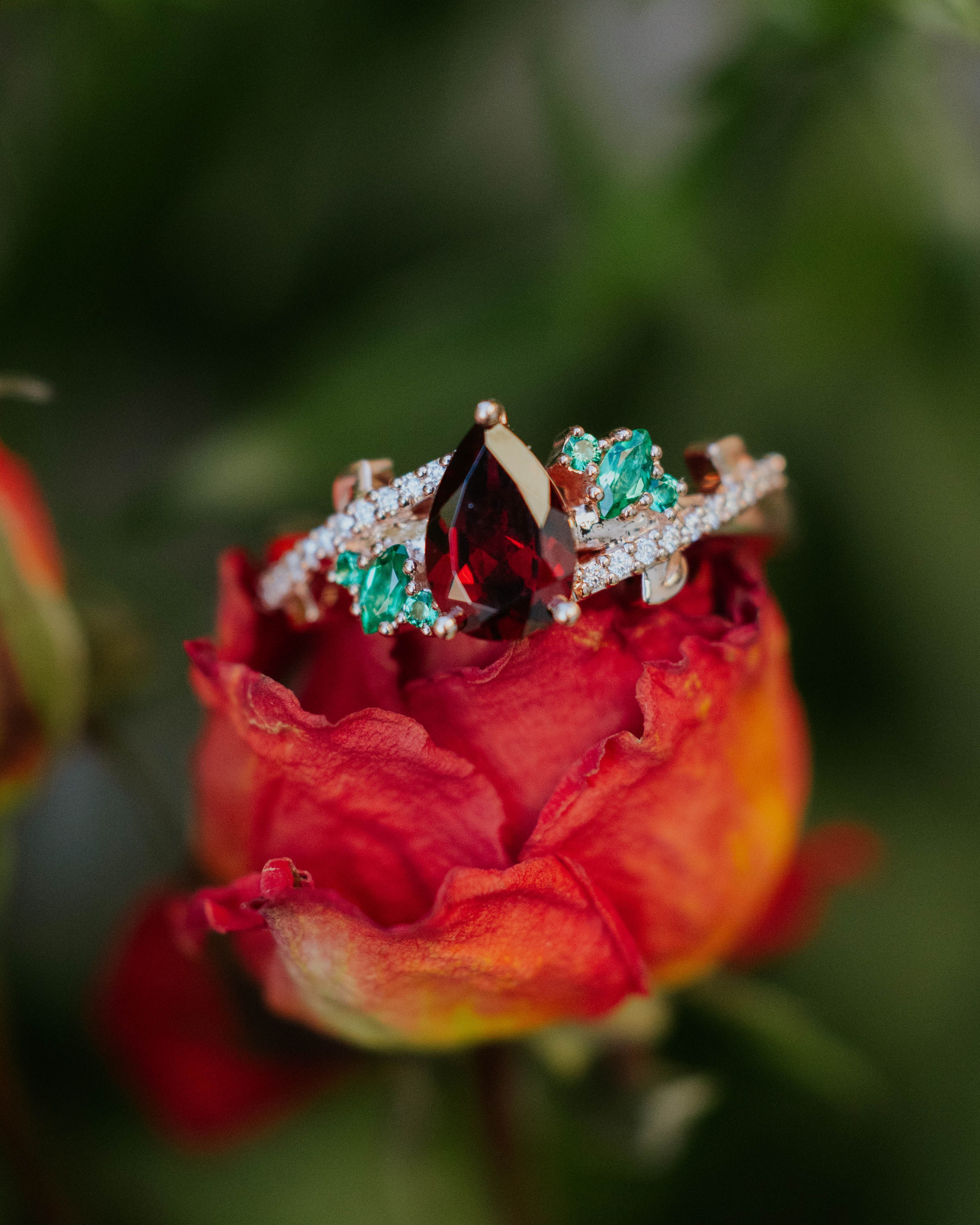 "KAMILA" - PEAR CUT MOZAMBIQUE GARNET ENGAGEMENT RING WITH LAB-GROWN EMERALD & DIAMOND ACCENTS-Staghead Designs