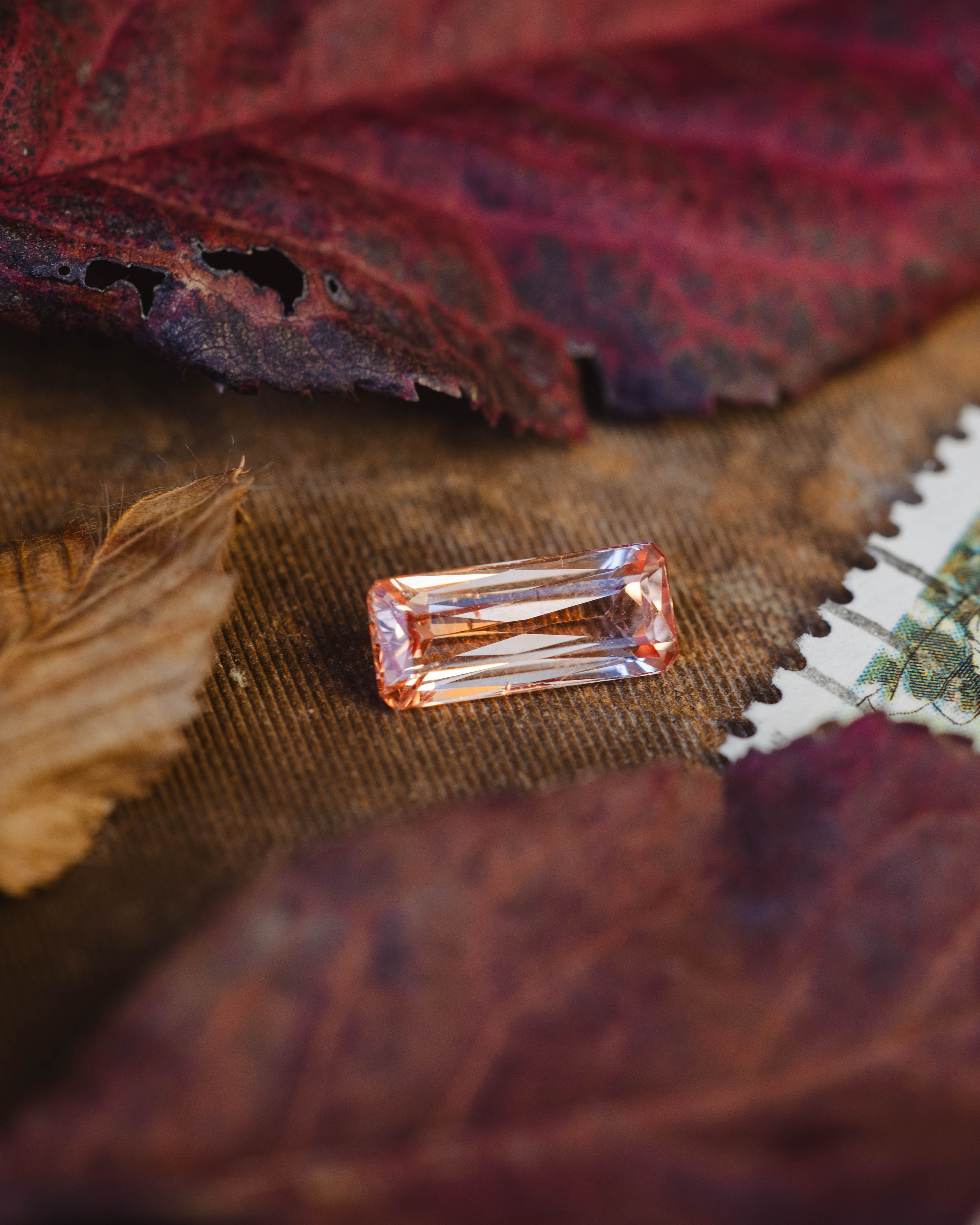 Rectangular gemstone on a textured fabric background
