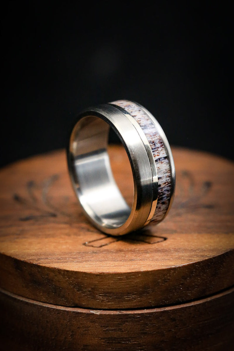 pictured is "Tanner" with antler overlay and gold inlay! "Tanner" is a custom, handcrafted men's wedding ring featuring an antler overlay and gold inlay with brushed finish. Additional inlay options are available upon request.