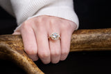 "OPHELIA" - ROUND CUT SKY BLUE TOPAZ ENGAGEMENT RING WITH DIAMOND HALO & ACCENTS