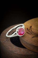 Shown here is The "Aura", a birthstone ring with a split shank-style & lab-created Ruby women's ring with delicate and ornate details and is available with many center stone options