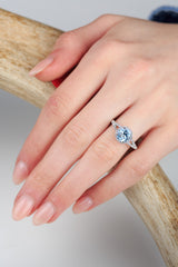 "AURA" - BIRTHSTONE RING WITH A SKY BLUE TOPAZ CENTER STONE WITH DIAMOND HALO & ACCENTS