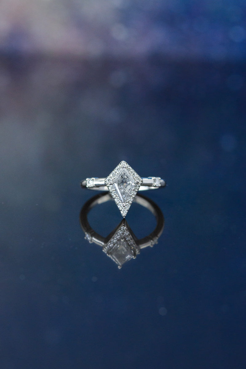 Shown here is The "Leija", an art deco-style kite cut salt & pepper diamond women's engagement ring with delicate and ornate details and is available with many center stone options