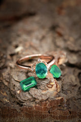 Shown on Wood Among Emerald Jewels is the ZELLA, an Oval Moissante Custom Engagement Ring With Diamond Accents