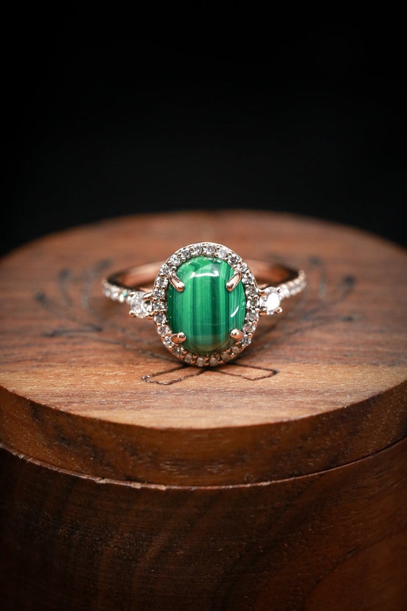 -Shown here is The "KB", a halo-style oval malachite women's engagement ring with delicate and ornate details and is available with many center stone options14K Gold Engagement Ring With Malachite & Diamond Accents - Staghead Designs