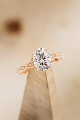 "NOUR" - OVAL MOISSANITE ENGAGEMENT RING WITH DIAMOND ACCENTS