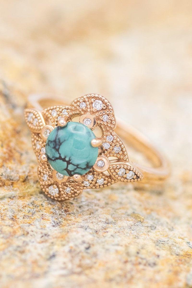 Shown here is a The "Florence", a vintage-style round turquoise women's engagement ring with delicate and ornate details and is available with many center stone options