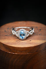 Shown here is an accented-style aquamarine women's engagement ring with delicate and ornate details and is available with many center stone options