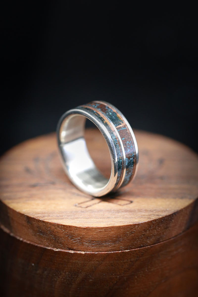 Shown here is "Raptor", a custom, handcrafted men's wedding ring featuring a patina copper inlay. Additional inlay options are available upon request.