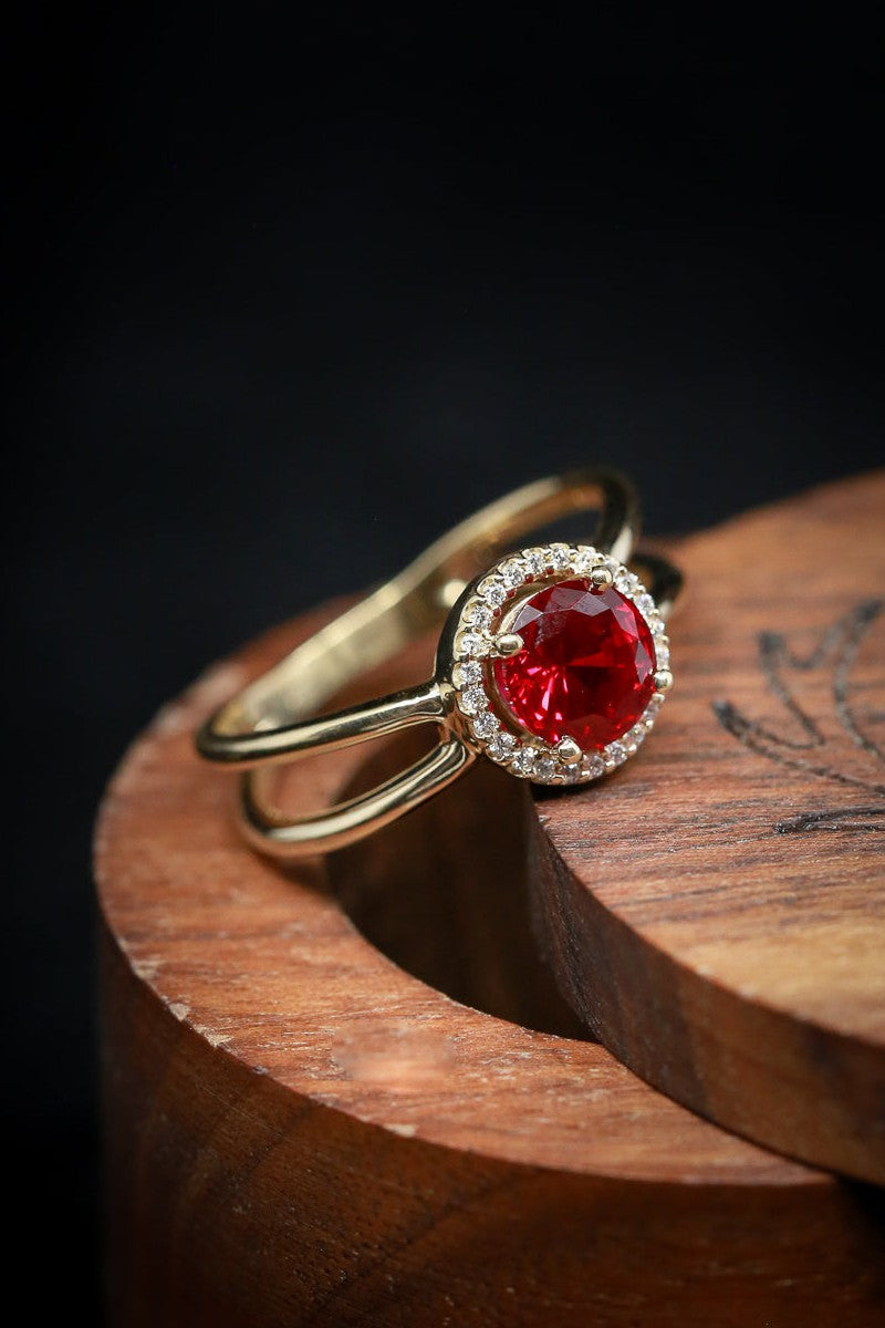 Shown here is A split shank-style lab-created ruby women's engagement ring with delicate and ornate details and is available with many center stone options