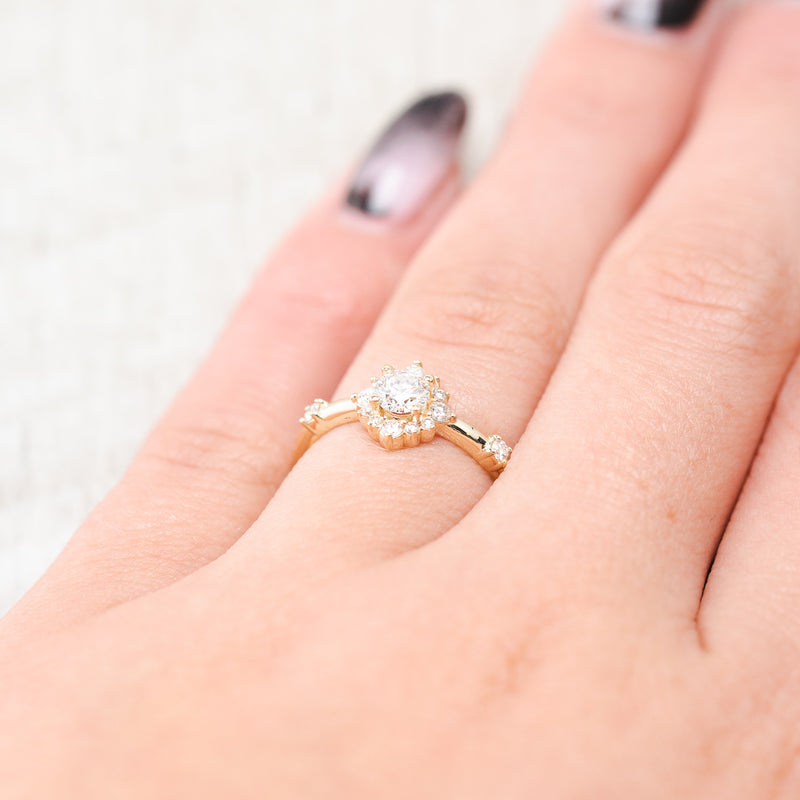 Shown here, Starla, a bridal suite-style diamond women's engagement ring with diamond accents and "Lea" tracers, on hand. Many other center stone options are available upon request. 