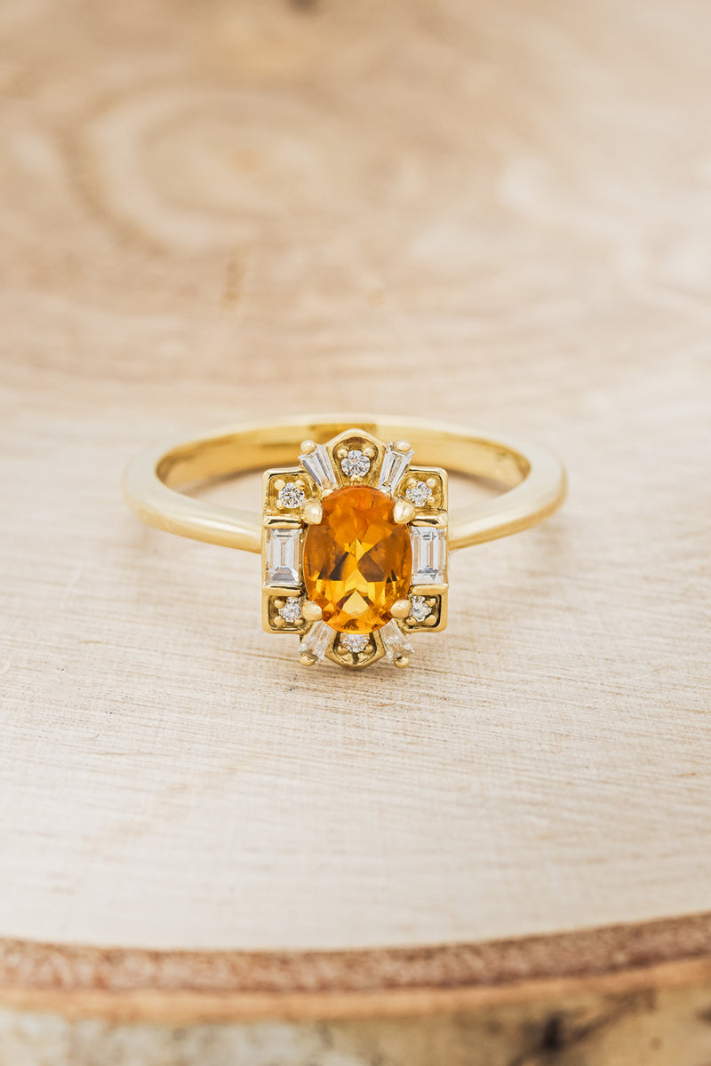 Shown here is"Cleopatra", a women's birthstone ring with a citrine center stone and diamond halo, front facing. Many other center stone options are available upon request.