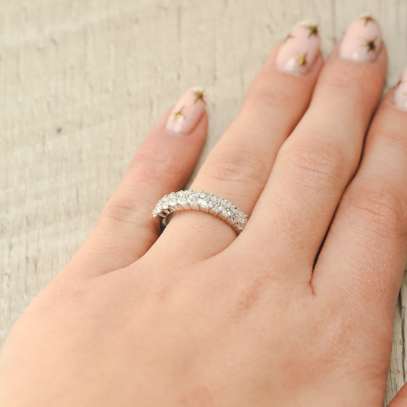 Shown here, Esmeree, is a custom, handcrafted women's stacking wedding band featuring marquise diamond accents on hand.