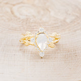 "ARTEMIS ON THE VINE DIVINE" - PEAR MOONSTONE ENGAGEMENT RING WITH DIAMOND ACCENTS & A BRANCH-STYLE BAND