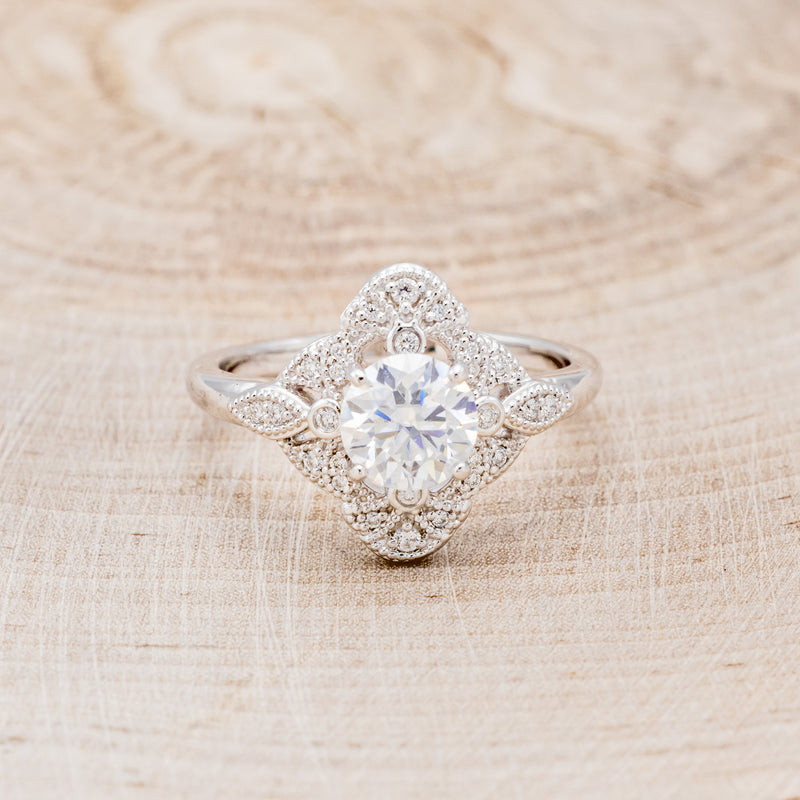 "FLORENCE" - ROUND CUT MOISSANITE ENGAGEMENT RING WITH DIAMOND ACCENTS