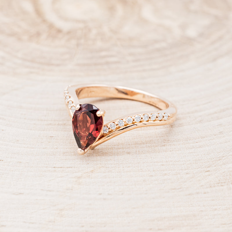 "IO" - PEAR-SHAPED GARNET ENGAGEMENT RING WITH DIAMOND ACCENTS