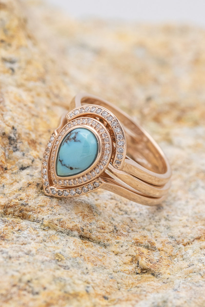 shown here is The "Terra" bridal suite, a halo-style turquoise women's engagement ring with delicate and ornate details and is available with many center stone options.