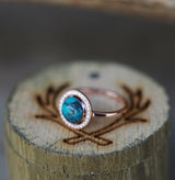 Shown here is The "Terra", a halo-style Turquoise women's engagement ring with delicate and ornate details and is available with many center stone options-"TERRA" ENGAGEMENT RING IN 14K GOLD & TURQUOISE WITH DIAMOND HALO (available in 14K rose, white or yellow gold) - Staghead Designs - Antler Rings By Staghead Designs
