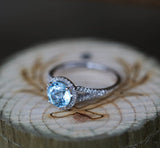 Shown here is A halo-style sky blue topaz women's engagement ring with delicate and ornate details and is available with many center stone options-14K GOLD & SKY BLUE TOPAZ WITH DIAMOND HALO ENGAGEMENT RING (available in 14K white gold) - Staghead Designs - Antler Rings By Staghead Designs