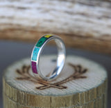 Shown here is a custom, handcrafted wedding ring featuring sugilite, turquoise, malachite, orpiment & jasper inlays, facing right. Additional inlay options are available upon request.
