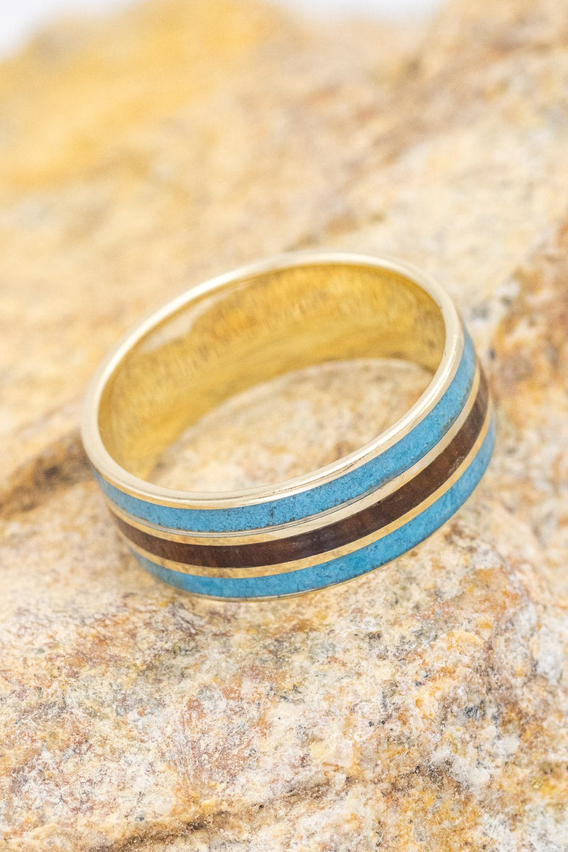 Shown here is "Rio", 3 channels ring featuring ironwood and turquoise inlays on a 14k yellow gold band.