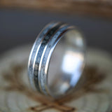 Shown here is "Rio", a custom, handcrafted men's wedding ring featuring elk antler and iron ore inlays, shown here on a silver band. Additional inlay options are available upon request.-"RIO" - SILVER RING WITH ANTLER & IRON ORE INLAYS (available in silver, black zirconium, damascus steel & 14K white, rose, or yellow gold) - Staghead Designs - Antler Rings By Staghead Designs