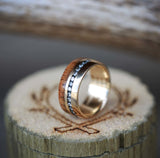 Shown here is A custom, handcrafted men's wedding ring featuring a 14K yellow gold band with 3/20 CTW diamonds and koa wood. Additional inlay options are available upon request. -KOA WOOD AND DIAMONDS SET ON 14K GOLD WEDDING BAND (available in 14K white, rose, or yellow gold) - Staghead Designs - Antler Rings By Staghead Designs
