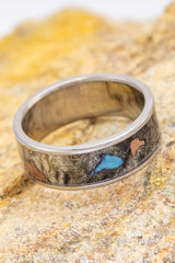 45 Degree Angle of buckeye burl, copper & turquoise "Rainier"! "Rainier" is a custom, handcrafted men's wedding ring featuring copper & turquoise set in buckeye burl. Additional inlay options are available upon request.