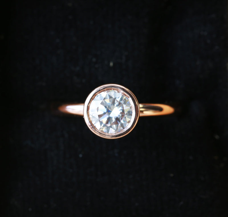 Shown here is a solitaire bezel-style moissanite women's engagement ring with delicate and ornate details and is available with many center stone options-14K GOLD SOLITAIRE ENGAGEMENT RING WITH 1ct MOISSANITE STONE (available in 14K rose, white, or yellow gold) - Staghead Designs - Antler Rings By Staghead Designs