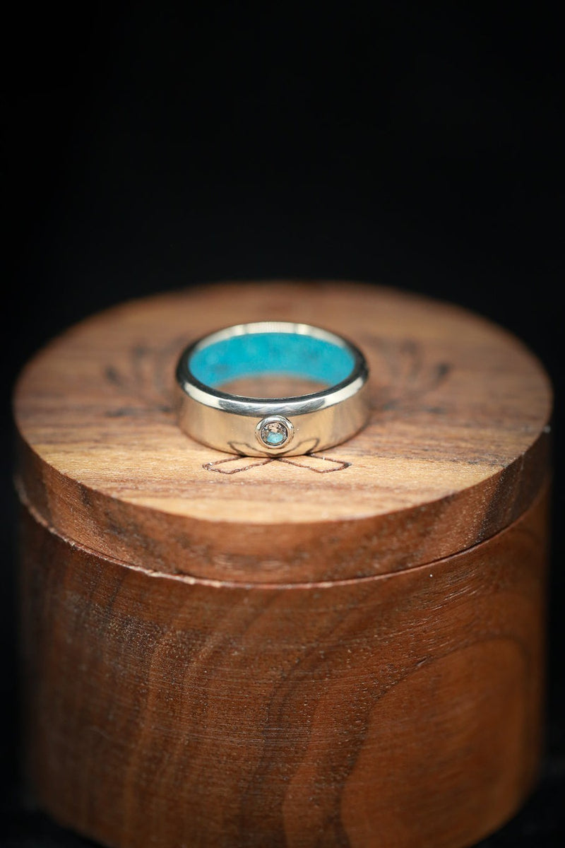 Shown here is A custom, handcrafted men's wedding ring featuring a .15 carat diamond on a 14K gold band with a turquoise lining. Additional inlay options are available upon request. -14K Gold Wedding Band With  a Single Diamond and Turquoise Lining - Staghead Designs