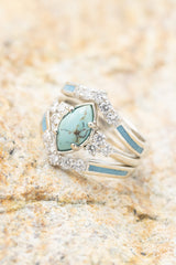 Shown here is The "Raya", an accented-style turquoise women's engagement ring and diamond ring guard with delicate and ornate details and is available with many center stone options.
