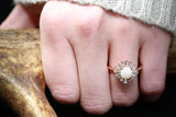 "BELLADONNA" - ROUND CUT OPAL ENGAGEMENT RING WITH DIAMOND HALO