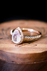 Shown here is a halo-style rose quartz women's engagement ring with delicate and ornate details and is available with many center stone options-Rose Gold Rose Quartz Diamond Halo Women's Engagement Ring - Staghead Designs 