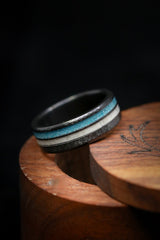Shown here is "Cosmo", a custom, handcrafted men's wedding ring featuring elk antler and hand-crushed turquoise offset into two channels, shown here on a hammered black zirconium band. Additional inlay options are available upon request.-Black Zirconium Wedding Band With Antler & Turquoise Inlays - Staghead Designs 