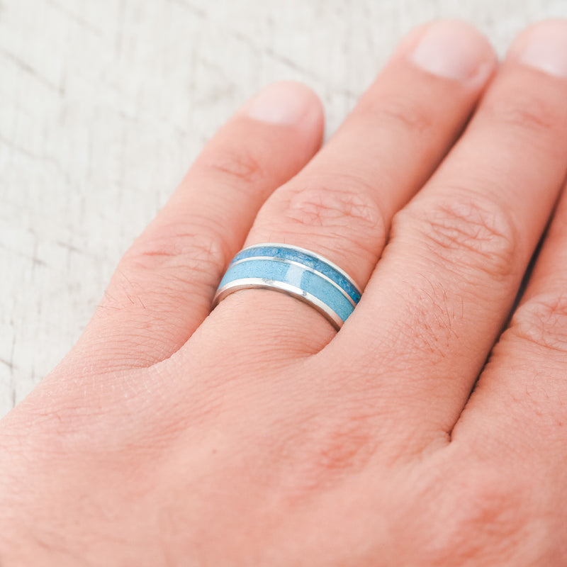 Shown here, Raptor, a custom, handcrafted men's wedding ring featuring a turquoise & blue opal inlay. Additional inlay options are available upon request.