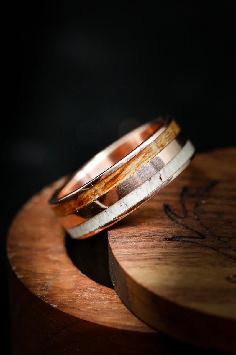 Shown here is A custom, handcrafted men's wedding ring featuring a whiskey barrel wood and antler inlay with a hammered finish. Additional inlay options are available upon request.-Whiskey Wood Wedding Ring with Antler & 14K Rose Gold - Staghead Designs