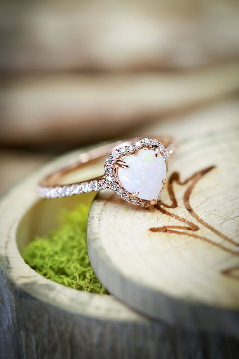 Shown here is a heart-shaped halo-style Australian white opal women's engagement ring with delicate and ornate details and is available with many center stone options-Women's Engagement Ring with Heart Shaped Opal and Diamond Accents - Staghead Designs
