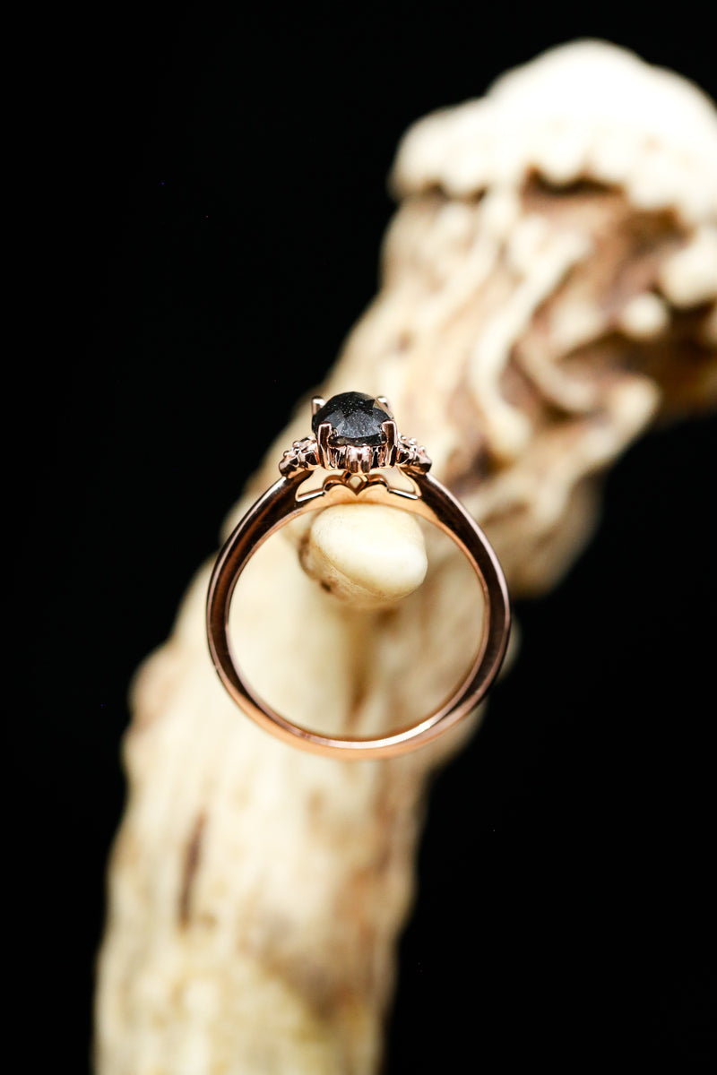 Zella Salt & Pepper Diamond Engagement Ring in front of antler