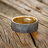 FACETED BLACK ZIRCONIUM WEDDING RING WITH A 14K GOLD LINING
