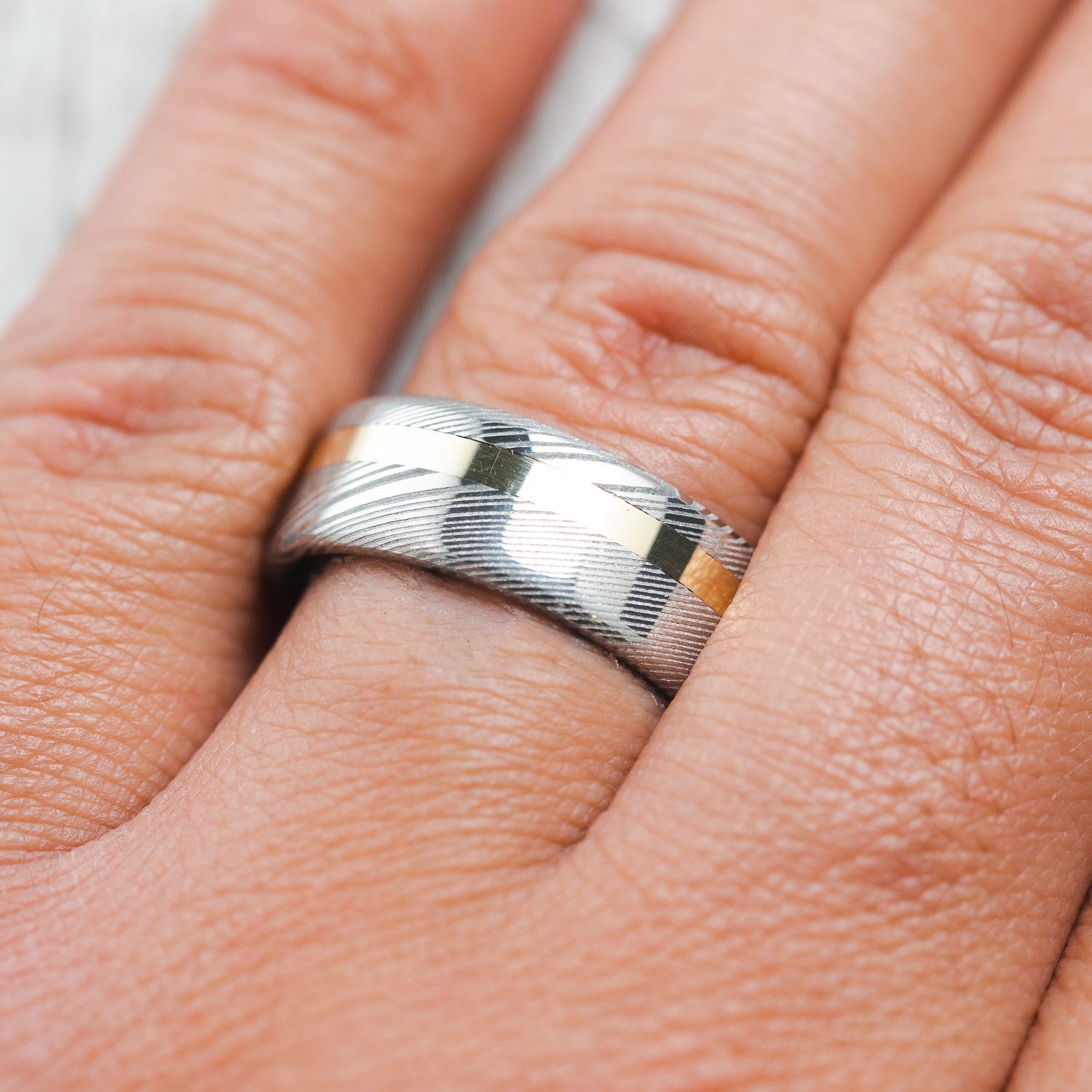 "VERTIGO" - DAMASCUS STEEL WEDDING RING WITH A 14K GOLD INLAY-6