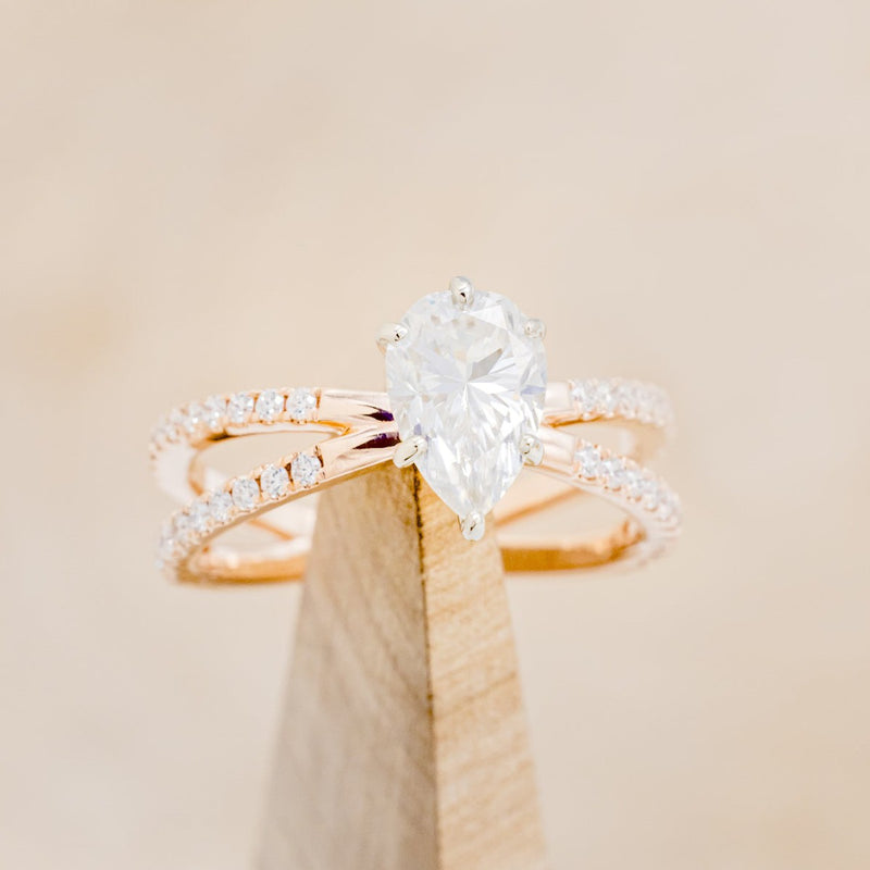 TWO TONED PEAR-SHAPED MOISSANITE ENGAGEMENT RING WITH DIAMOND ACCENTS