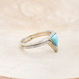 Shown here is "Jenny From The Block", a dainty-style triangle turquoise women's engagement ring with a diamond v-shaped tracer, facing right. Many other center stone options are available upon request.