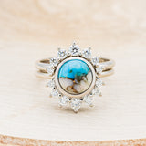 Shown here is "Esmeralda", a round cut spiny oyster turquoise women's engagement ring with diamond accents and a diamond tracer, front facing. Many other center stone options are available upon request.
