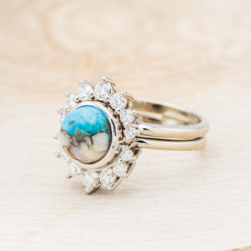 Shown here is "Esmeralda", a round cut spiny oyster turquoise women's engagement ring with diamond accents and a diamond tracer, facing right. Many other center stone options are available upon request.