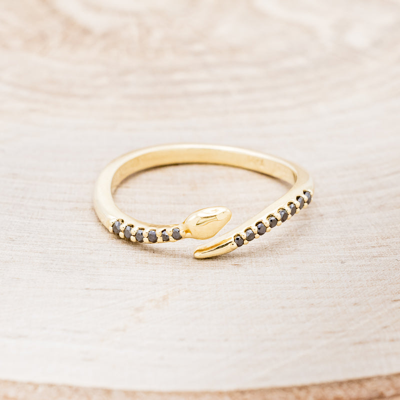 Shown here is "Serpent", a snake-style wedding band featuring black diamond accents, front facing.