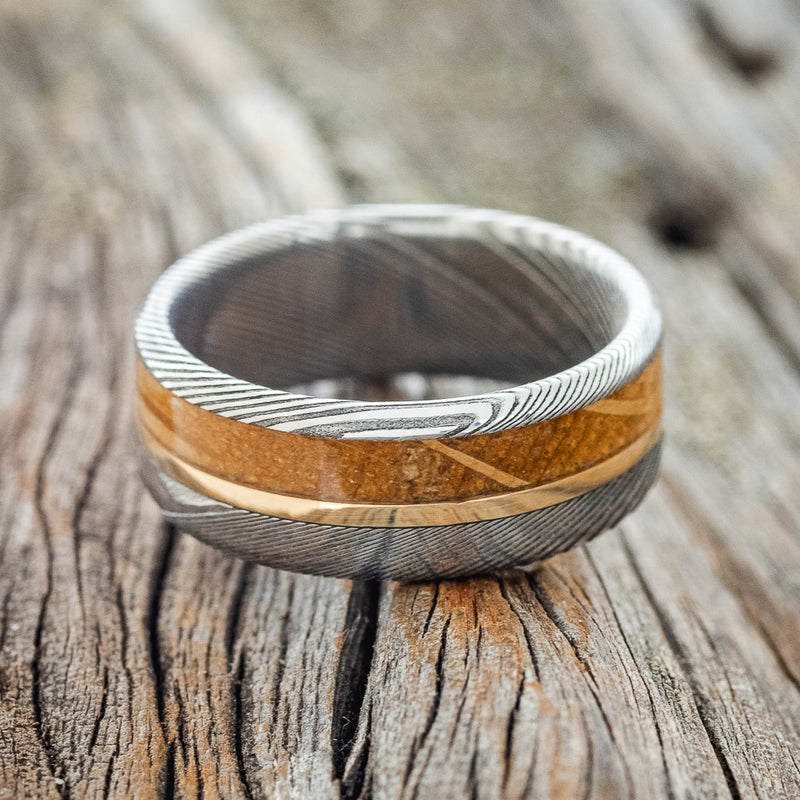 "TANNER" - WHISKEY BARREL & 14K GOLD INLAY WEDDING RING FEATURING A DAMASCUS STEEL BAND