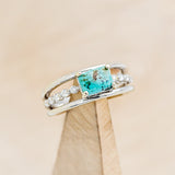 Shown here is "Dolly", a turquoise women's engagement ring with diamond accents, on stand facing slightly right. Many other center stone options are available upon request.